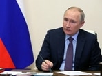 Russia's President Vladimir Putin chairs a meeting.