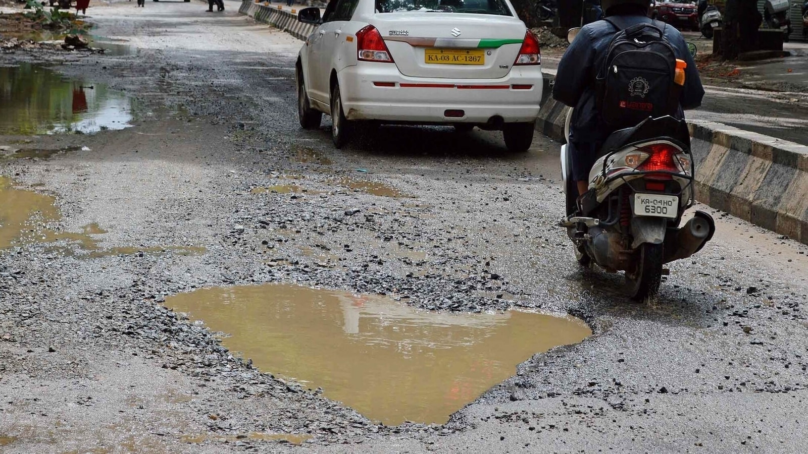 Biker skids on waterlogged road, run over by truck in Bengaluru