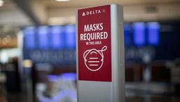 An outdated sign requiring Delta Air Lines passengers to wear a face mask to board a plane is displayed in the domestic terminal of the Hartsfield-Jackson Atlanta International Airport after Biden's administration announced that it will no longer enforce a U.S. mask mandate on public transportation, following a Florida court ruling, in Atlanta, Georgia, US. (REUTERS)