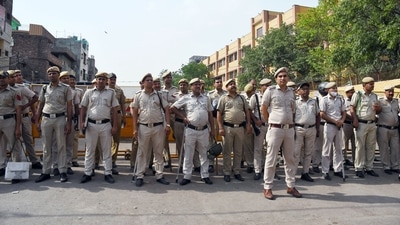 Police personnel stand guard at the incident site where a clash broke out between two communities during the procession on Hanuman Jayanti, at Jahangirpuri, in New Delhi. (ANI) Police personnel stand guard at the incident site where a clash broke out between two communities during the procession on Hanuman Jayanti, at Jahangirpuri, in New Delhi. (ANI)