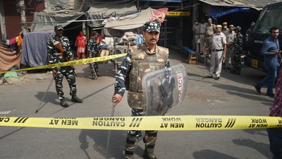 Security personnel keep vigil after clashes broke out between two communities during a Hanuman Jayanti procession on Saturday, at Jahangirpuri in New Delhi, Monday. (PTI) Security personnel keep vigil after clashes broke out between two communities during a Hanuman Jayanti procession on Saturday, at Jahangirpuri in New Delhi, Monday. (PTI)