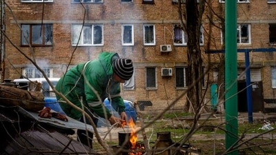 Volodymyr Lukyanovych, 63, cooks his dinner outside his house since his building was destroyed by Russian shelling in Irpin, on the outskirts of Kyiv, on Wednesday. (AP) Volodymyr Lukyanovych, 63, cooks his dinner outside his house since his building was destroyed by Russian shelling in Irpin, on the outskirts of Kyiv, on Wednesday. (AP)