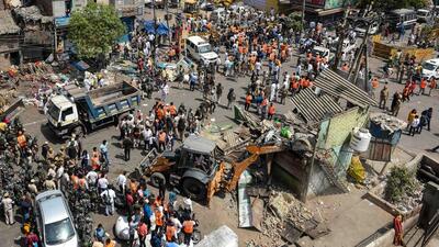 An aerial view of a bulldozer demolishing an illegal structure during an anti-encroachment drive by North Delhi Municipal Corporation, in Jahangirpuri, New Delhi, on Wednesday, April 20, 2022. (Amal KS/HT Photo) An aerial view of a bulldozer demolishing an illegal structure during an anti-encroachment drive by North Delhi Municipal Corporation, in Jahangirpuri, New Delhi, on Wednesday, April 20, 2022. (Amal KS/HT Photo)