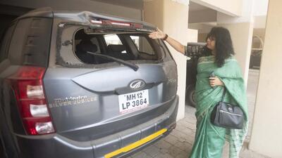 Vaishali Patkar, a resident of Bella Casa society, shows damages that happened to her car due to a controlled blast incident at Sus-Pashan road in Pune. (Pratham Gokhale/HT Photo)