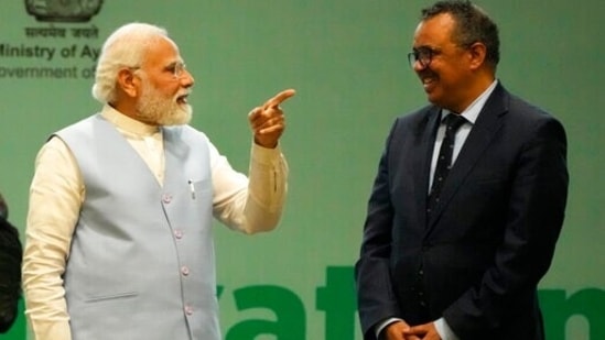 Prime Minister Narendra Modi talks with WHO director-general Tedros Adhanom Ghebreyesus during the Global Ayush Investment and Innovation Summit 2022 in Gandhinagar on Wednesday.(AP)