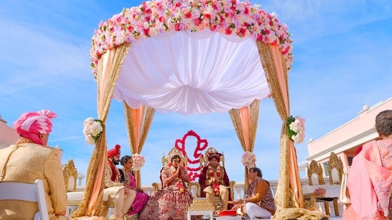 In the last few years, every facet of Indian weddings has altered dramatically and wedding decor is no different as it too has undergone a full transformation and personalisation which is no longer limited to basic hanging or scrunched-up draperies and hackneyed floral arrangements. Instead, it has taken centre stage and the newness abounds with each passing day has resulted in the birth of unique and fresh trends. Even the tiniest details are given significant consideration. For example, opting for light colours and fresh flowers, as well as focusing the entire design on a theme, from the mandap to the bar and the stage. This transformation can majorly be attributed to the exposure that Indian audiences have got via social media, celebs weddings and global trends. Owing to all of these factors, Indian wedding decoration ideas have unquestionably improved and there's no turning back now!(Photo by Amish Thakkar on Unsplash)