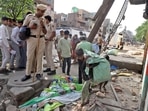 Police personnel stand guard during an anti-encroachment drive on Wednesday which was stalled by the Supreme Court. (ANI) Police personnel stand guard during an anti-encroachment drive on Wednesday which was stalled by the Supreme Court. (ANI)
