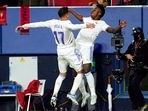LaLiga - Osasuna v Real Madrid - El Sadar Stadium, Pamplona, Spain - April 20, 2022 Real Madrid's Lucas Vazquez celebrates scoring their third goal with Vinicius Junior