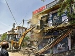 A bulldozer demolishes the structure during the anti-encroachment drive following the violence between two groups during the Hanuman Jayanti procession on April 16, at Jahangirpuri, in New Delhi on Wednesday, April 20, 2022. (ANI Photo/Rahul Singh)
