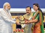 Prime Minister Narendra Modi confers Prime Minister's Award for Excellence in Public Administration to Chamoli DM Swati Bhadauria during a valedictory session and awards ceremony on the occasion of 15th Civil Services Day, in New Delhi, Thursday, April 21, 2022. (PTI Photo/Kamal Singh) Prime Minister Narendra Modi confers Prime Minister's Award for Excellence in Public Administration to Chamoli DM Swati Bhadauria during a valedictory session and awards ceremony on the occasion of 15th Civil Services Day, in New Delhi, Thursday, April 21, 2022. (PTI Photo/Kamal Singh)