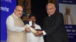 Union home minister Amit Shah confers awards during the 13th National Investigation Agency (NIA) Day programme, at Dr Ambedkar International Centre, in New Delhi, Thursday, April 21, 2022. Union MoS for Home Affairs Ajay Mishra Teni and Nisith Pramanik are also seen. (PTI Photo/Manvender Vashist) Union home minister Amit Shah confers awards during the 13th National Investigation Agency (NIA) Day programme, at Dr Ambedkar International Centre, in New Delhi, Thursday, April 21, 2022. Union MoS for Home Affairs Ajay Mishra Teni and Nisith Pramanik are also seen. (PTI Photo/Manvender Vashist)