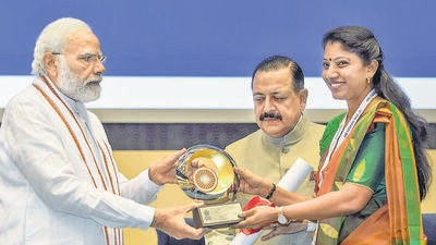 Prime Minister Narendra Modi confers Prime Minister’s Award for Excellence in Public Administration to Chamoli DM Swati Bhadauria, in New Delhi on Thursday.  (PTI)