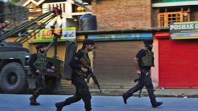 Security personnel in action after an encounter between security forces and militants in Baramulla on Friday. (ANI Photo) Security personnel in action after an encounter between security forces and militants in Baramulla on Friday. (ANI Photo)