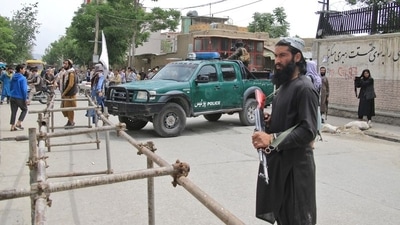 Taliban fighters stand guard at the site of an explosion in Kabul, Afghanistan, April 19. (REUTERS file)