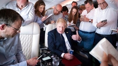 Prime Minister Boris Johnson speaks to the media on board his flight as he flies to India for a two-day visit on Wednesday. (AP) Prime Minister Boris Johnson speaks to the media on board his flight as he flies to India for a two-day visit on Wednesday. (AP)