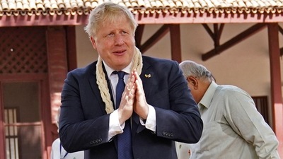 Britain's Prime Minister Boris Johnson gestures during his visit at the Sabarmati Ashram also known as Gandhi Ashram in Ahmedabad on April 21, 2022. (Photo by Stefan Rousseau / POOL / AFP) (AFP) Britain's Prime Minister Boris Johnson gestures during his visit at the Sabarmati Ashram also known as Gandhi Ashram in Ahmedabad on April 21, 2022. (Photo by Stefan Rousseau / POOL / AFP) (AFP)