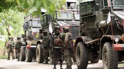 Security forces stand guard after an encounter between security forces and terrorists took place, at Malwa, in Baramulla. (ANI) Security forces stand guard after an encounter between security forces and terrorists took place, at Malwa, in Baramulla. (ANI)