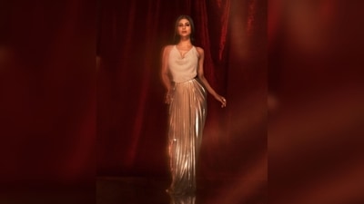The outfit comes with a pearl top that features thin straps and a metallic saree inspired pleated skirt. (Instagram/@imouniroy) The outfit comes with a pearl top that features thin straps and a metallic saree inspired pleated skirt. (Instagram/@imouniroy)
