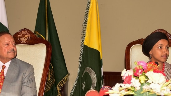 US congresswoman Ilhan Omar (R) and ‘President’ of Pakistan-occupied Kashmir Sultan Mehmood Chaudhry. (Photo by Sajjad QAYYUM / AFP)