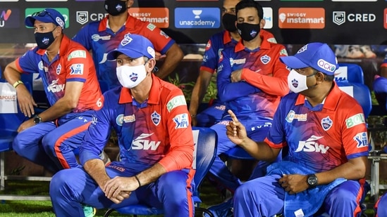 Delhi Capitals coaches Ricky Ponting, Ajit Agarkar and Praveen Amre and others sit at the team dugout, during the Indian Premier League 2022 cricket match between against Punjab Kings(PTI)