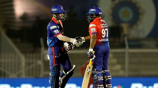 David Warner of Delhi Capitals being congratulated by teammate Sarfaraz Khan after his half century(PTI)