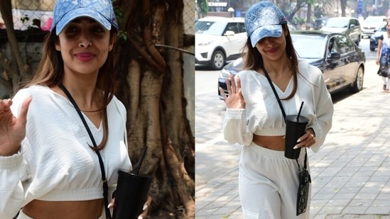 Malaika's wardrobe is replete with summer-ready essentials, and one of them is a crop top. After all, those abs deserve every moment in the sun. So, for today's outing, the Chaiyya Chaiyya girl chose street-ready midriff-baring separates and styled them with chic accessories.(HT Photo/Varinder Chawla)