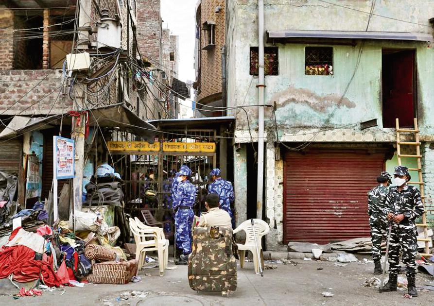 Paramilitary force stand guard at an alley after Wednesday's demolition of illegal encroachments in Jahangirpuri, in New Delhi. Paramilitary force stand guard at an alley after Wednesday's demolition of illegal encroachments in Jahangirpuri, in New Delhi.