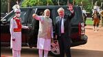 British Prime Minister Boris Johnson waves as his Indian counterpart Narendra Modi watches after a ceremonial reception at India's presidential palace Rashtrapati Bhavan, in New Delhi on Friday, April 22, 2022. (Reuters) British Prime Minister Boris Johnson waves as his Indian counterpart Narendra Modi watches after a ceremonial reception at India's presidential palace Rashtrapati Bhavan, in New Delhi on Friday, April 22, 2022. (Reuters)