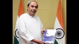 Odisha CM Naveen Patnaik releases a book titled 'The Sikh History of East India', a compilation of the Sikh history of eastern India, at Naveen Niwas, in Bhubaneswar on Friday. (ANI)
