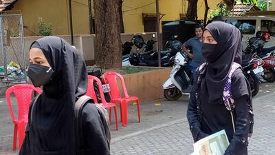 Hijab row petitioner Aliya Assadi and Resham return from their colleges after authorities allegedly disallowed them to appear in PUC exam for wearing a hijab, in Udupi, on Friday. (PTI)