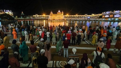 The entire Golden Temple was illuminated and devotees lit earthen lamps to celebrate the occasion. (PTI) The entire Golden Temple was illuminated and devotees lit earthen lamps to celebrate the occasion. (PTI)