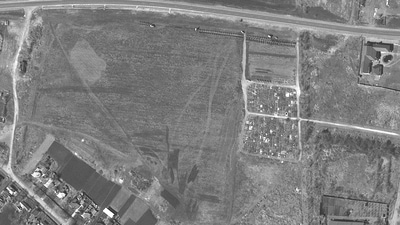 A satellite image shows an overview of cemetery and expansion of the new graves in Manhush, near Mariupol. (REUTERS)