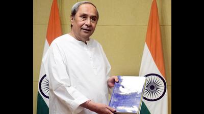Odisha CM Naveen Patnaik releases a book titled 'The Sikh History of East India', a compilation of the Sikh history of eastern India, at Naveen Niwas, in Bhubaneswar on Friday. (ANI)