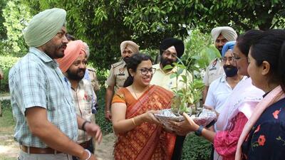 Ludhiana DC Surabhi Malik, along with other district administration officials, planting tree saplings at Rakh Bagh to mark Earth day. (Harvinder Singh/ HT)