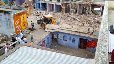 A bulldozer being used to demolish a 300-year-old Shiva temple at Sarai Mohalla, in Alwar district of Rajasthan. (PTI) A bulldozer being used to demolish a 300-year-old Shiva temple at Sarai Mohalla, in Alwar district of Rajasthan. (PTI)