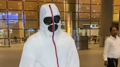 Raj Kundra in a full face covered mask.