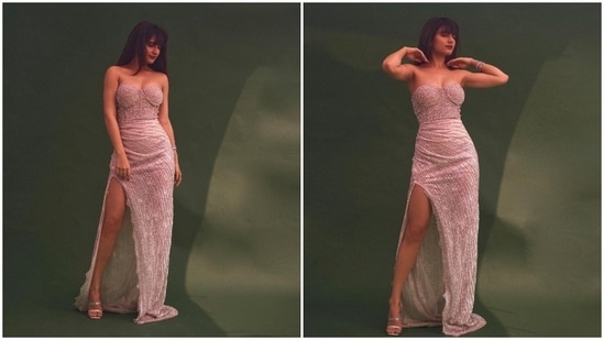 In this picture, Fatima Sana Shaikh can be seen raising the hotness quotient in a shimmery Falguni Shane Peacock thigh-high slit dress.(Instagram/@fatimasanashaikh)
