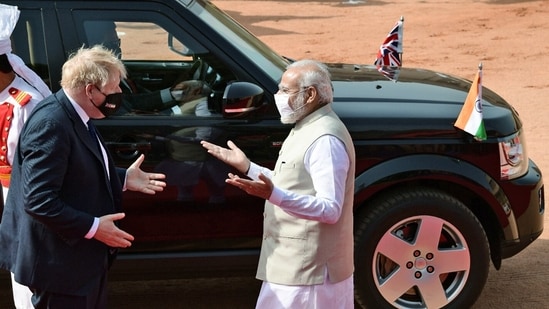 Prime Minister Narendra Modi receiving UK Prime Minister Boris Johnson with a ceremonial reception at Rashtrapati Bhawan, in New Delhi on Friday.