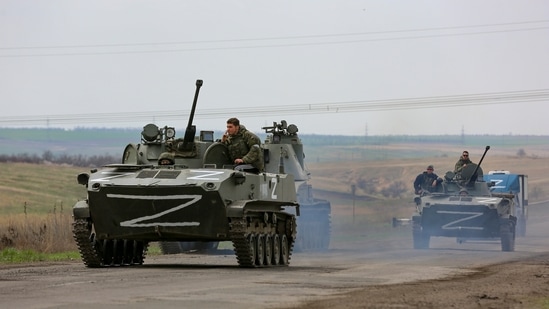 Russian military vehicles move on a highway in an area controlled by Russian-backed separatist forces near Mariupol, Ukraine.(AP)