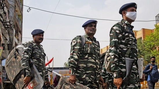 Paramilitary personnel patrol a site after clashes broke out between two communities during the procession on Hanuman Jayanti, at Jahangirpuri. (ANI)(ANI) Paramilitary personnel patrol a site after clashes broke out between two communities during the procession on Hanuman Jayanti, at Jahangirpuri. (ANI)(ANI)