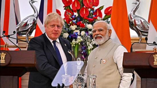 British Prime Minister Boris Johnson shakes hands with his Indian counterpart Narendra Modi during a joint press briefing at the Hyderabad House in New Delhi. (REUTERS)