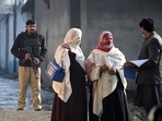 Pakistan is one of two countries - with Afghanistan - where polio still remains endemic. In photo- a policeman escorts health workers during a door-to-door polio vaccination campaign on the outskirts of Mardan, in Khyber Pakhtunkhwa province on January 24, 2022.(AFP file photo. ) Pakistan is one of two countries - with Afghanistan - where polio still remains endemic. In photo- a policeman escorts health workers during a door-to-door polio vaccination campaign on the outskirts of Mardan, in Khyber Pakhtunkhwa province on January 24, 2022.(AFP file photo. )