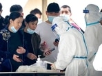 People register for COVID-19 tests at a coronavirus testing facility in Beijing, Saturday. (AP Photo/Mark Schiefelbein) People register for COVID-19 tests at a coronavirus testing facility in Beijing, Saturday. (AP Photo/Mark Schiefelbein)