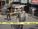 Security personnel keep vigil after clashes broke out between two communities during a Hanuman Jayanti procession on Saturday, at Jahangirpuri in New Delhi. (PTI Photo/Shahbaz Khan)