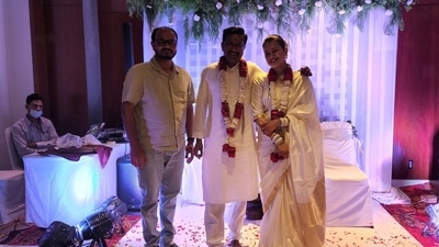In another photo shared by Raj Patil, an advocate at the Supreme Court, the couple can be seen in white traditional outfits with garlands on their neck. (Facebook/Raj Patil) In another photo shared by Raj Patil, an advocate at the Supreme Court, the couple can be seen in white traditional outfits with garlands on their neck. (Facebook/Raj Patil)