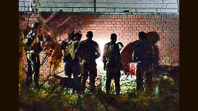 Army and bomb disposal teams at the spot where the suspicious material was discovered near Model Jail, Sector 51, in Chandigarh on Saturday night. (Ravi Kumar/HT)