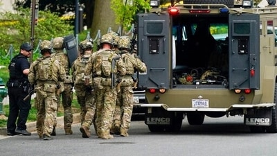 Police and federal agents respond to a shooting in northwest Washington. (AP) Police and federal agents respond to a shooting in northwest Washington. (AP)