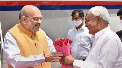 Patna: Union Home Minister Amit Shah being welcomed by Bihar Chief Minister Nitish Kumar on his arrival at Japrakash Narayan Airport, in Patna, Saturday, April 23, 2022. (PTI Photo) (PTI)