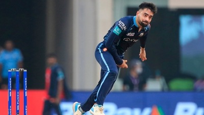 Rashid Khan of Gujarat Titans bowls during T20 cricket match 35 of the Indian Premier League 2022 (PTI) Rashid Khan of Gujarat Titans bowls during T20 cricket match 35 of the Indian Premier League 2022 (PTI)