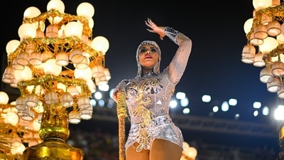 The all-night parades by the city's top samba schools Friday and Saturday nights are the first since February 2020, marking a turning point for hard-hit Brazil, where Covid-19 has claimed more than 660,000 lives, second only to the United States.. (Andres Borges/Bloomberg) The all-night parades by the city's top samba schools Friday and Saturday nights are the first since February 2020, marking a turning point for hard-hit Brazil, where Covid-19 has claimed more than 660,000 lives, second only to the United States.. (Andres Borges/Bloomberg)
